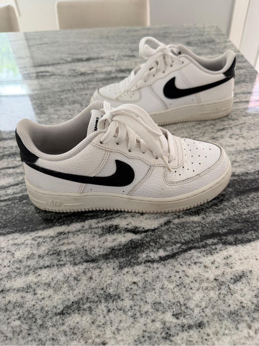 Nike White Low-Top Sneakers with Black Swoosh 4Y